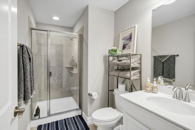 Bathroom features walk-in tile shower. | Image 33
