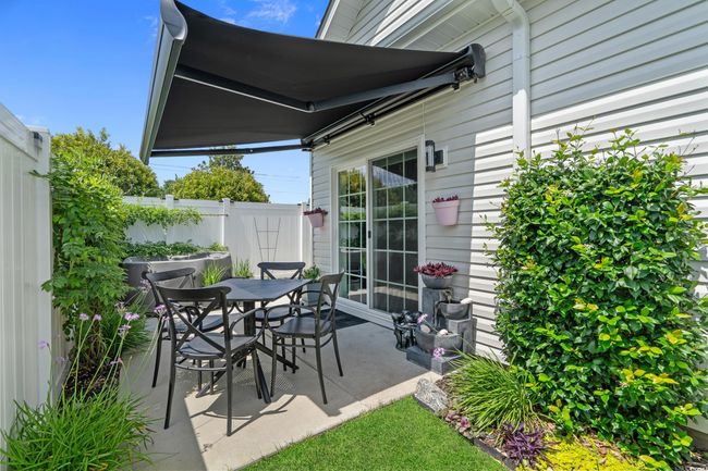 View of patio with outdoor dining space | Image 35