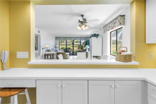 Kitchen looking into dining living | Image 16