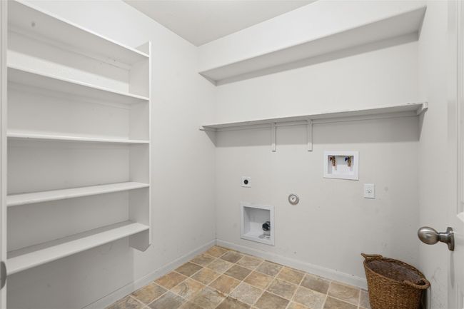 Laundry room with shelving | Image 24