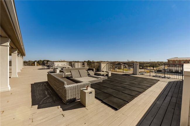 Wooden terrace with a residential view and outdoor lounge area | Image 47