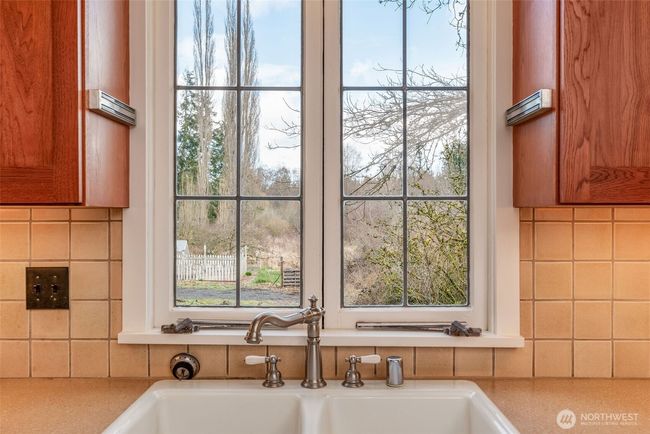 Leaded glass casement windows throughout house. | Image 10