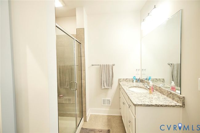 Full bath featuring vanity and a shower stall | Image 12
