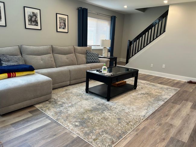 Living room with stairway, wood finished floors, recessed lighting, and baseboards | Image 24