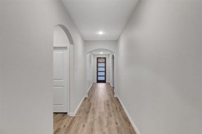 Hall with light wood-type flooring | Image 3