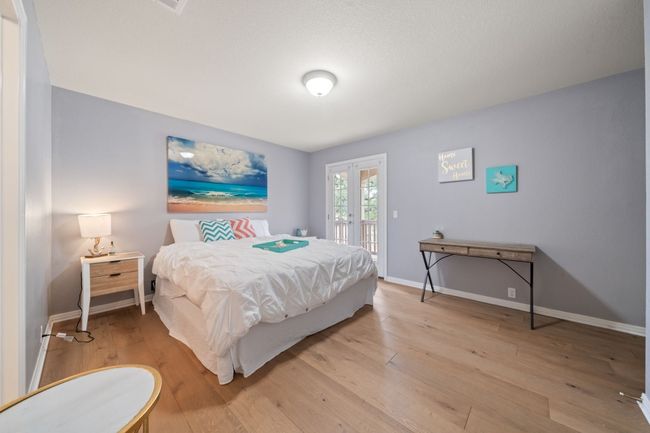 Bedroom featuring french doors, access to exterior, and light wood finished floors | Image 18