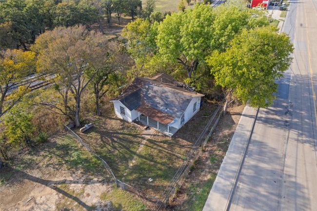 View from above of property with a tree filled landscape | Image 4