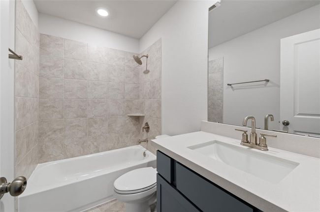 Full bathroom located on the second floor, offering convenient access for upstairs bedrooms and guests. | Image 16