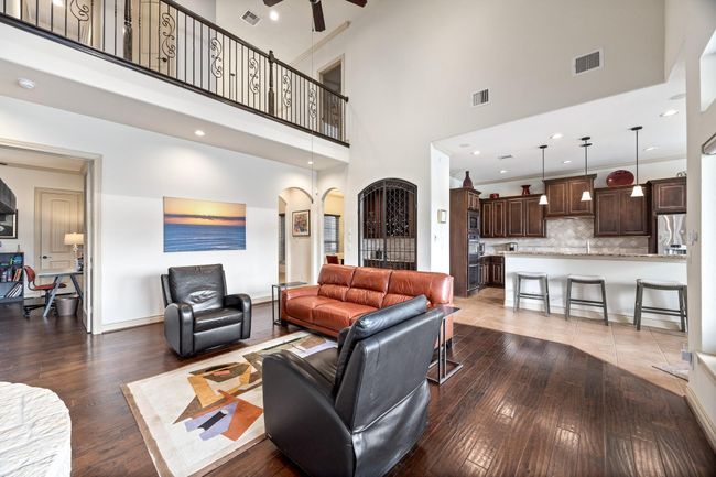 Another view of the main living room with the kitchen & breakfast area in the background. | Image 13