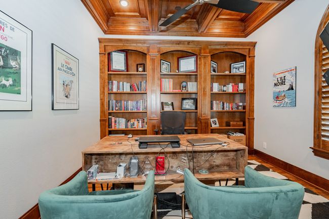 Office area featuring a ceiling fan, crown molding, wood finished floors, wooden ceiling, and baseboards | Image 4