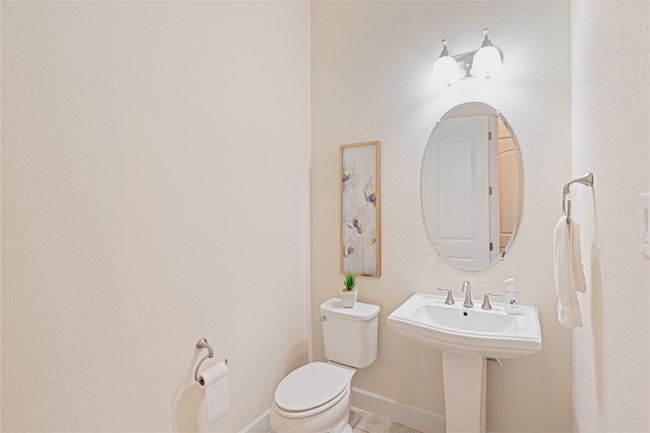 Bathroom with toilet and tile patterned floors | Image 26