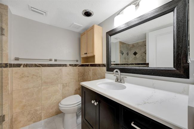 Bath 2 with a large vanity and mirroe with lots of storage | Image 15