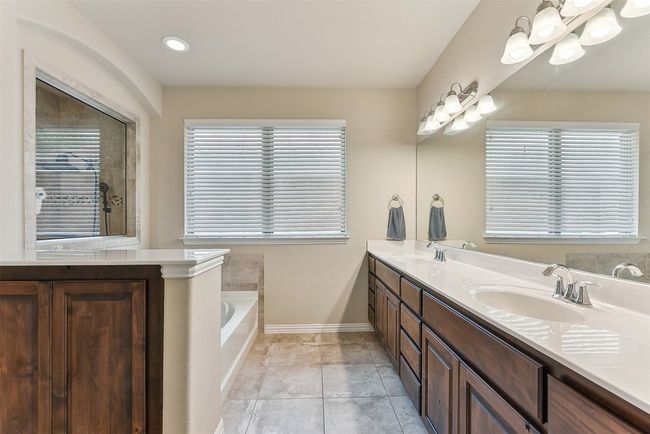 The ensuite bath feels like your own private spa | Image 18