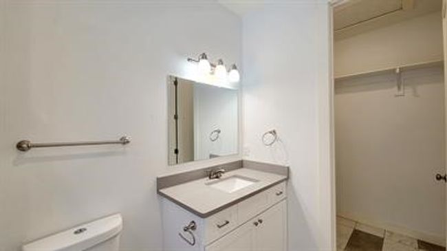 Bathroom featuring toilet and vanity | Image 16