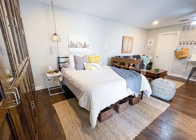 Bedroom with visible vents, recessed lighting, baseboards, and wood finished floors | Image 10