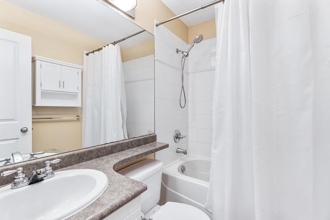 Full bath with toilet, vanity, and shower / tub combo with curtain | Image 21