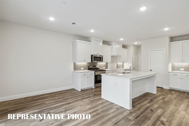 An open concept floor plan designed for entertaining! REPRESENTATIVE PHOTO | Image 5