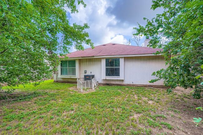Rear view of property featuring a yard | Image 26