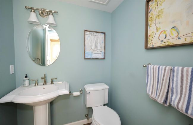 Bathroom featuring baseboards, visible vents, toilet, and a sink | Image 15