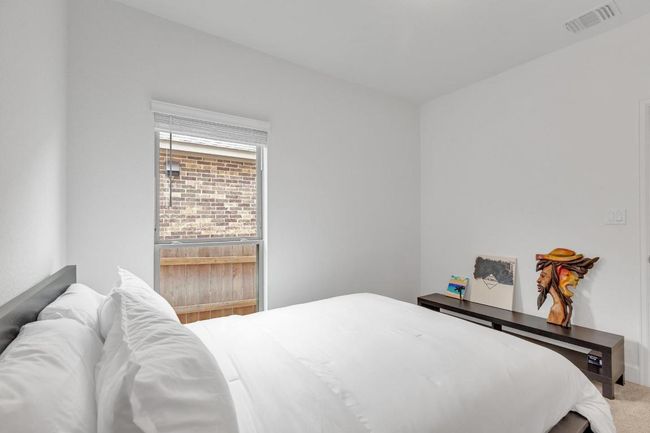 Bedroom with carpet | Image 26