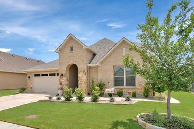 View of front facade featuring a garage and a front yard | Image 3