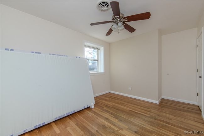 Empty room with ceiling fan and hardwood / wood-style floors | Image 21