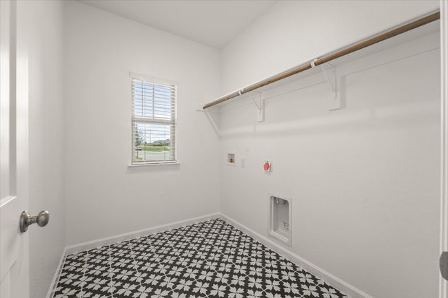 Laundry area with tile patterned floors, washer hookup, hookup for a gas dryer, and electric dryer hookup | Image 5