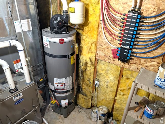 Utility room with water heater and furnace | Image 32