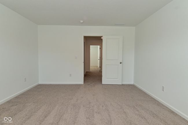 carpeted spare room with baseboards and a smoke detector | Image 54