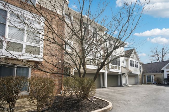 Multi unit property with an attached garage, brick siding, and driveway | Image 40