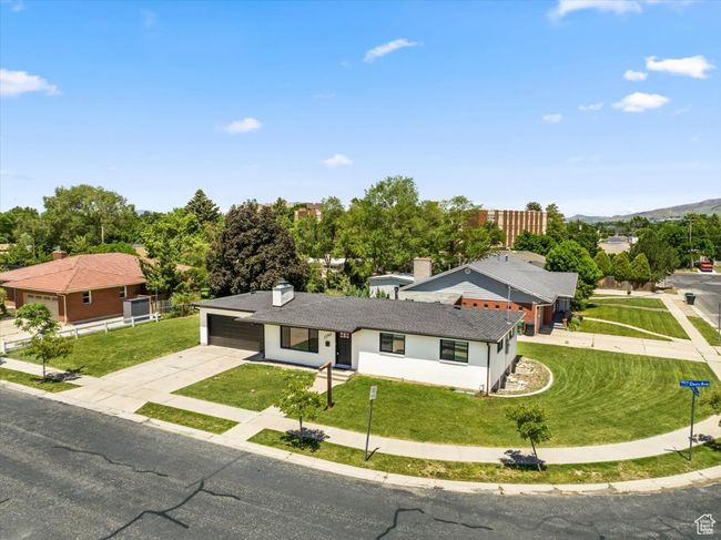 View of front of property featuring concrete driveway and a front yard | Image 36