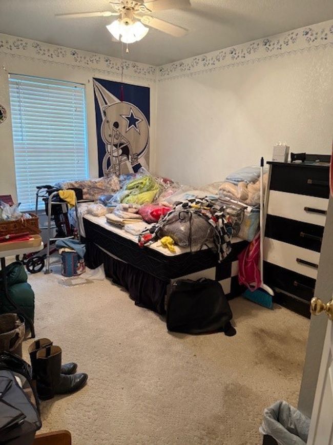Carpeted bedroom featuring ceiling fan | Image 29