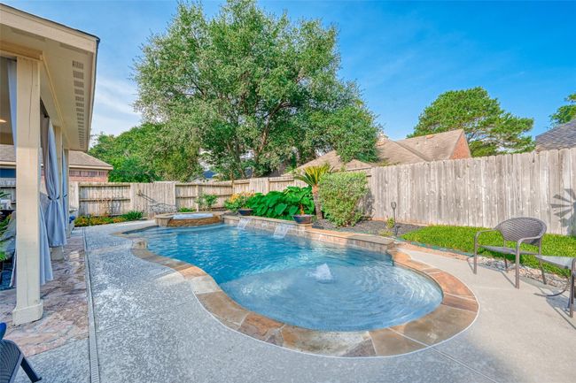 Heated Pool/Spa with 2 fire bowls & sun shelf. | Image 45