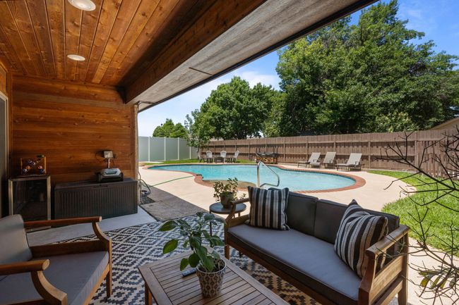 Fenced backyard with a patio and an outdoor living space | Image 31
