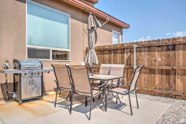 View of patio with area for grilling and outdoor dining space | Image 21