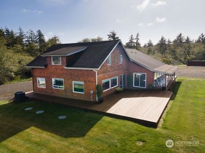 With over 1, 700 sq ft of covered and open deck space, this home provides a variety of choices to get all the sun you need. Great for large get-togethers, intimate weddings or just sit back and relax and enjoy the quiet sounds of nature in this heavenly environment | Image 3