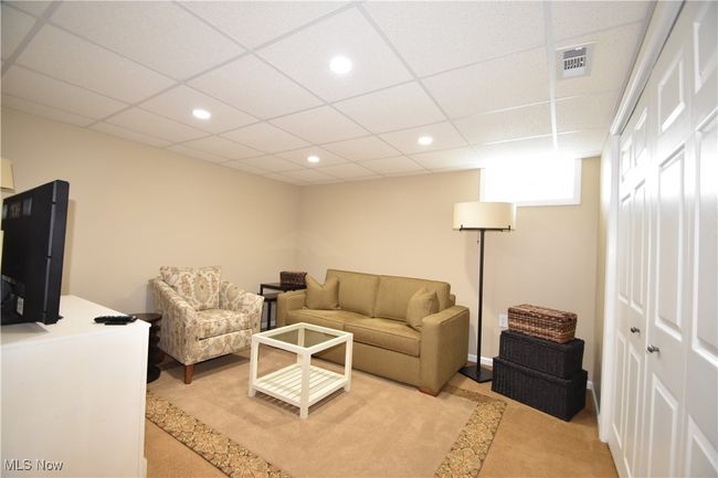 Rec room featuring light colored carpet, recessed lighting, and a drop ceiling | Image 21
