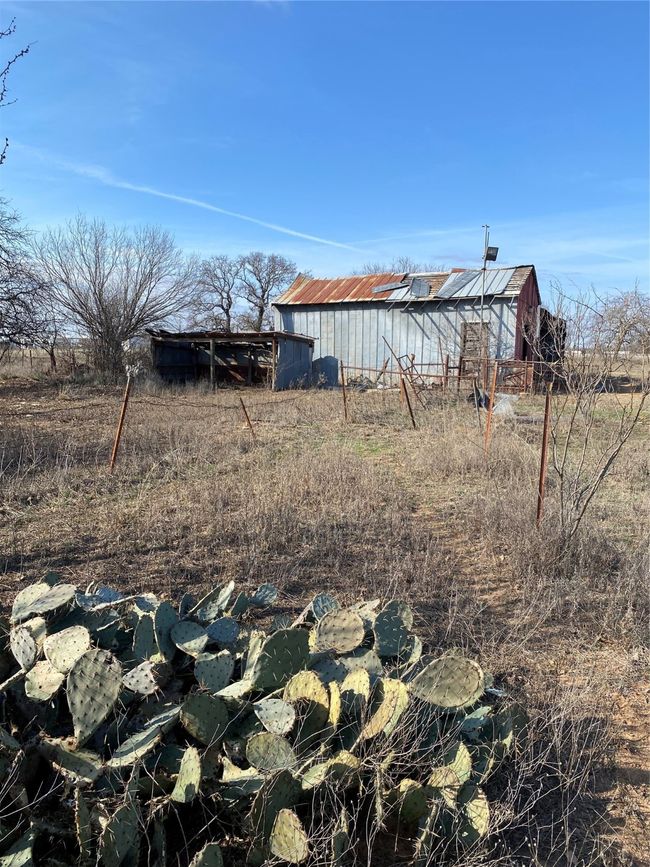 View of yard featuring a rural view and an outbuilding | Image 5