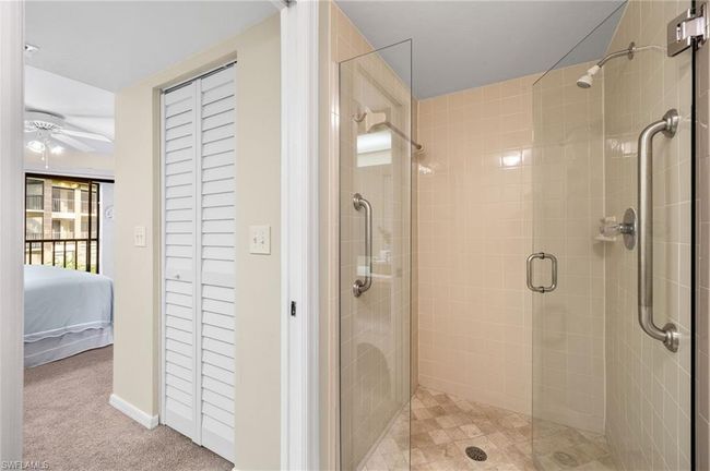 Bathroom with ceiling fan and walk in shower | Image 16