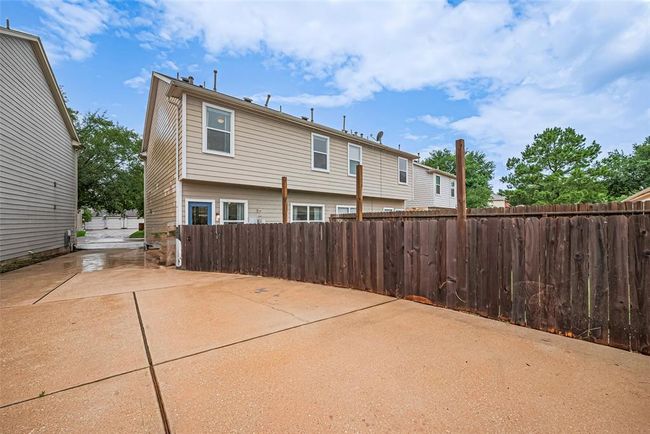 View from garage to the street. This is a shared drive with the neighbor, but they have their own garage. | Image 26