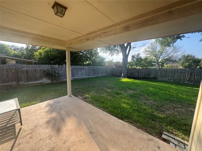 Fenced backyard featuring a patio area | Image 14