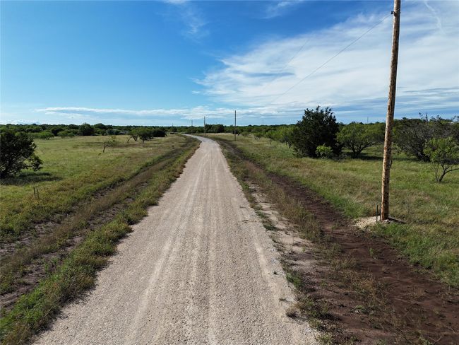 View of dirt / gravel road featuring a view of countryside | Image 11