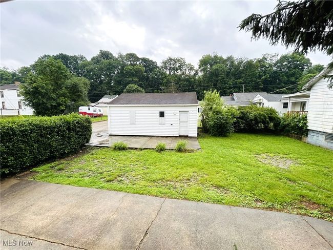 View of green lawn featuring an outdoor structure | Image 17