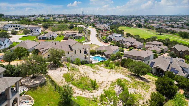 Aerial perspective of suburban area with a pool area | Image 8
