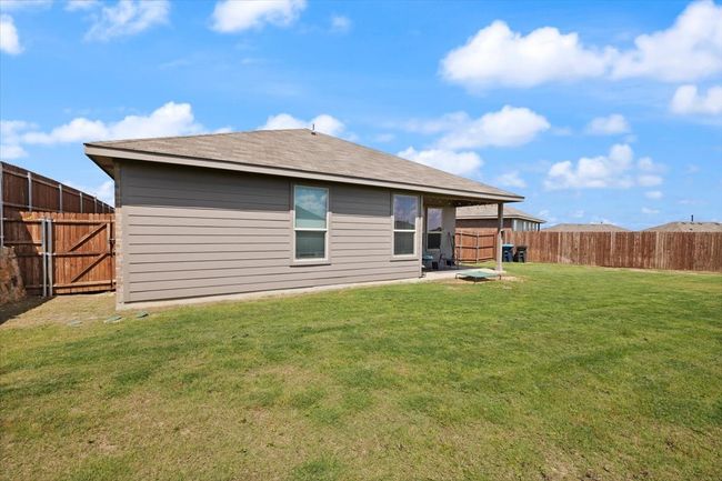 Covered back patio with large corner lot backyard. | Image 29