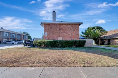 View of side of home with a lawn | Image 2