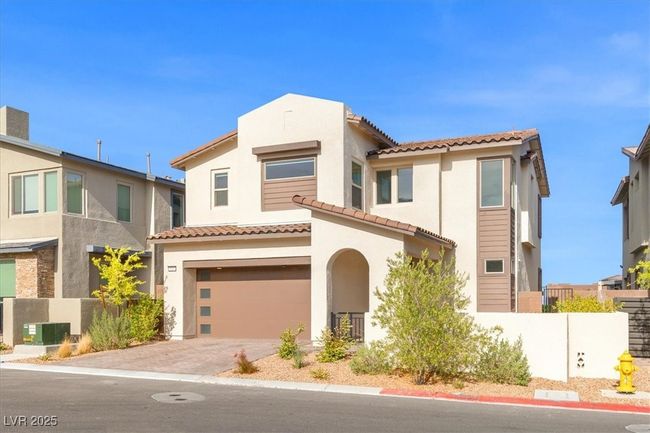 Mediterranean / spanish house featuring driveway, a tiled roof, stucco siding, an attached garage, and fence | Image 15