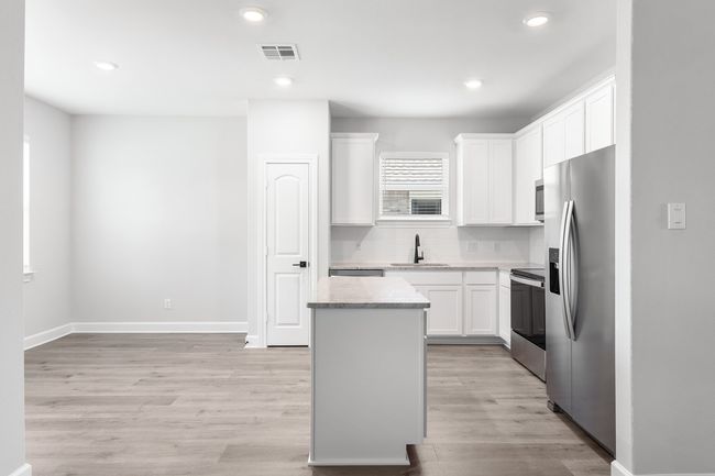 Dining area and kitchen. | Image 4