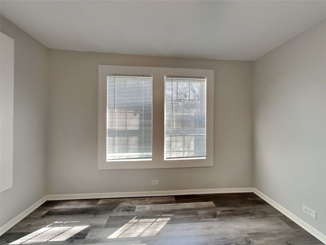 Empty room featuring wood finished floors and baseboards | Image 7