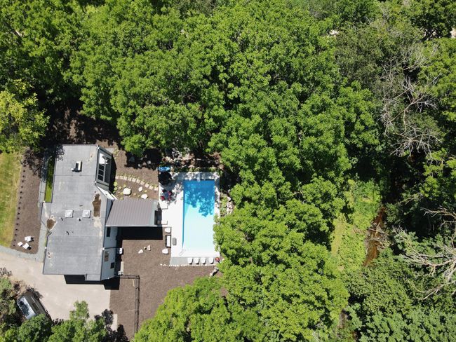 See open space next to creek. Has fire pit and ideal location for hockey rink! | Image 40